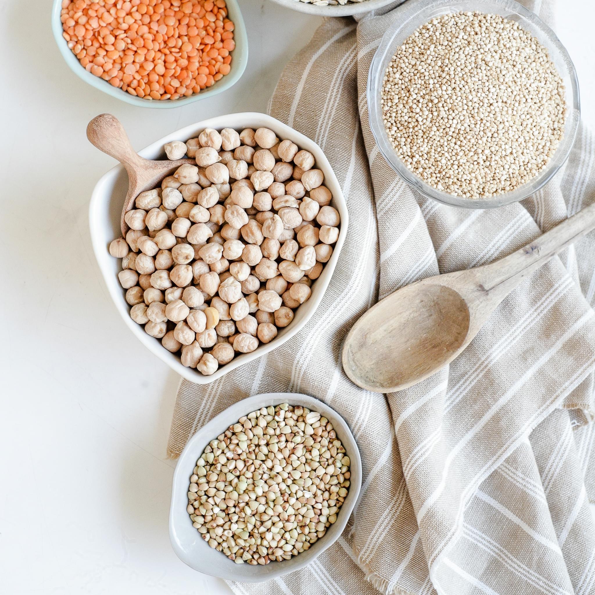 Bowls of lentils, chickpeas, quinoa and buckwheat