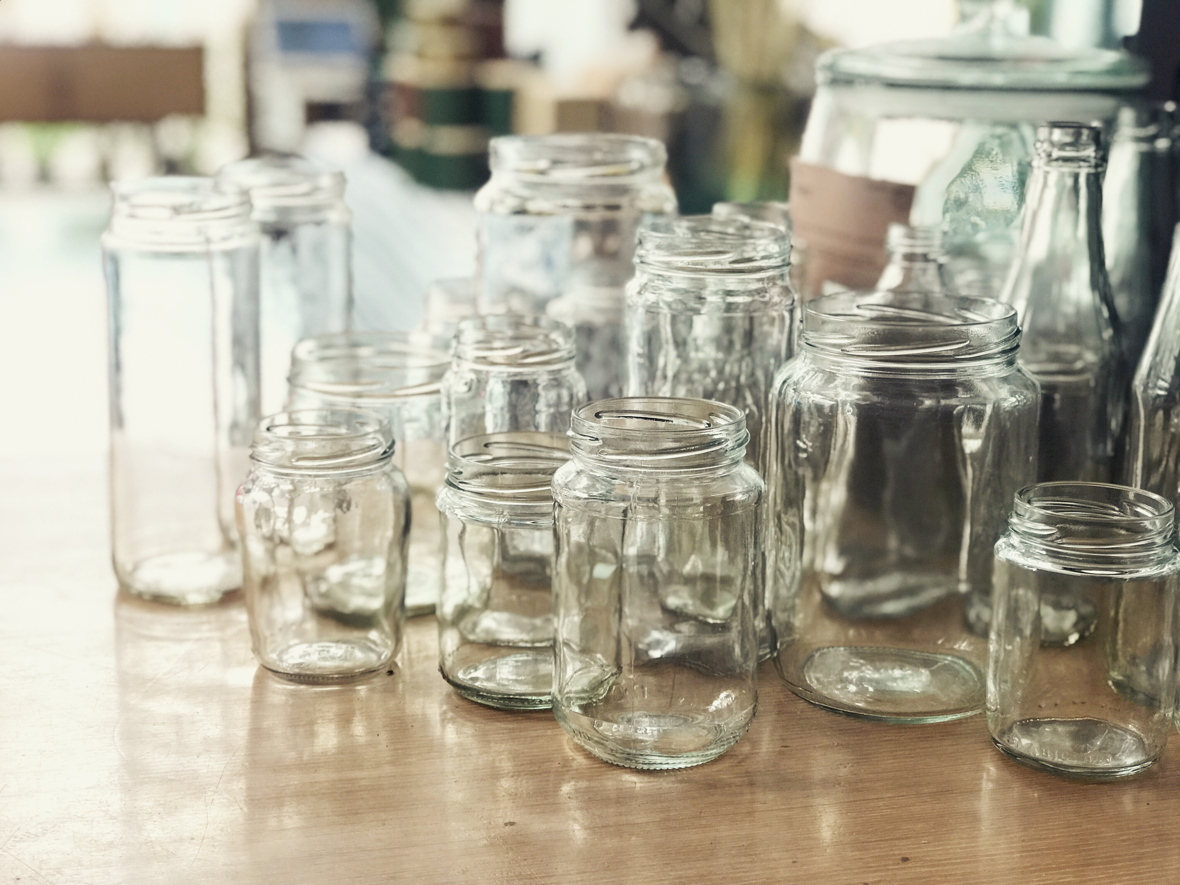 Empty glass jars lined up on the shop counter